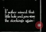 Image of woman darning stockings Kansas City Missouri USA, 1922, second 31 stock footage video 65675078312