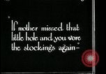 Image of woman darning stockings Kansas City Missouri USA, 1922, second 32 stock footage video 65675078312
