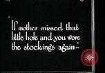 Image of woman darning stockings Kansas City Missouri USA, 1922, second 36 stock footage video 65675078312