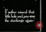 Image of woman darning stockings Kansas City Missouri USA, 1922, second 37 stock footage video 65675078312