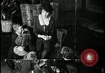 Image of woman darning stockings Kansas City Missouri USA, 1922, second 44 stock footage video 65675078312
