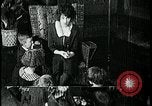 Image of woman darning stockings Kansas City Missouri USA, 1922, second 45 stock footage video 65675078312