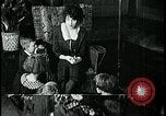 Image of woman darning stockings Kansas City Missouri USA, 1922, second 46 stock footage video 65675078312
