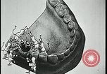 Image of woman darning stockings Kansas City Missouri USA, 1922, second 56 stock footage video 65675078312