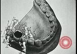 Image of woman darning stockings Kansas City Missouri USA, 1922, second 57 stock footage video 65675078312