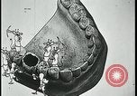 Image of woman darning stockings Kansas City Missouri USA, 1922, second 59 stock footage video 65675078312
