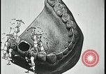 Image of woman darning stockings Kansas City Missouri USA, 1922, second 60 stock footage video 65675078312