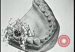 Image of woman darning stockings Kansas City Missouri USA, 1922, second 61 stock footage video 65675078312