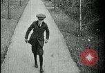 Image of boy walking Kansas City Missouri USA, 1922, second 8 stock footage video 65675078315