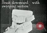 Image of brushing teeth Kansas City Missouri USA, 1922, second 17 stock footage video 65675078316