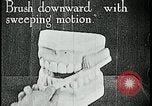 Image of brushing teeth Kansas City Missouri USA, 1922, second 18 stock footage video 65675078316