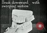 Image of brushing teeth Kansas City Missouri USA, 1922, second 21 stock footage video 65675078316