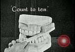 Image of brushing teeth Kansas City Missouri USA, 1922, second 25 stock footage video 65675078316
