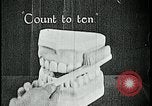 Image of brushing teeth Kansas City Missouri USA, 1922, second 26 stock footage video 65675078316