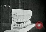Image of brushing teeth Kansas City Missouri USA, 1922, second 30 stock footage video 65675078316