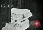 Image of brushing teeth Kansas City Missouri USA, 1922, second 31 stock footage video 65675078316
