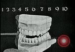 Image of brushing teeth Kansas City Missouri USA, 1922, second 35 stock footage video 65675078316