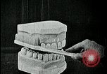 Image of brushing teeth Kansas City Missouri USA, 1922, second 43 stock footage video 65675078316