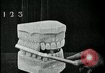 Image of brushing teeth Kansas City Missouri USA, 1922, second 45 stock footage video 65675078316
