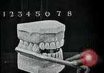 Image of brushing teeth Kansas City Missouri USA, 1922, second 48 stock footage video 65675078316