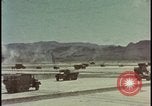 Image of atom bomb blast test destroying vehicles Nevada United States USA, 1955, second 1 stock footage video 65675078365