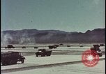 Image of atom bomb blast test destroying vehicles Nevada United States USA, 1955, second 3 stock footage video 65675078365