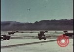 Image of atom bomb blast test destroying vehicles Nevada United States USA, 1955, second 6 stock footage video 65675078365