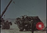 Image of atom bomb blast test destroying vehicles Nevada United States USA, 1955, second 16 stock footage video 65675078365