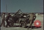 Image of atom bomb blast test destroying vehicles Nevada United States USA, 1955, second 20 stock footage video 65675078365