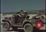 Image of atom bomb blast test destroying vehicles Nevada United States USA, 1955, second 25 stock footage video 65675078365