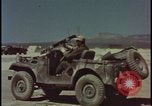 Image of atom bomb blast test destroying vehicles Nevada United States USA, 1955, second 26 stock footage video 65675078365
