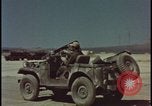 Image of atom bomb blast test destroying vehicles Nevada United States USA, 1955, second 27 stock footage video 65675078365