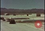 Image of atom bomb hitting oil barrels Nevada United States USA, 1955, second 1 stock footage video 65675078369
