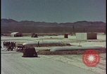 Image of atom bomb hitting oil barrels Nevada United States USA, 1955, second 3 stock footage video 65675078369