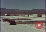 Image of atom bomb hitting oil barrels Nevada United States USA, 1955, second 4 stock footage video 65675078369