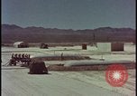 Image of atom bomb hitting oil barrels Nevada United States USA, 1955, second 5 stock footage video 65675078369