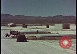 Image of atom bomb hitting oil barrels Nevada United States USA, 1955, second 6 stock footage video 65675078369
