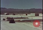 Image of atom bomb hitting oil barrels Nevada United States USA, 1955, second 7 stock footage video 65675078369