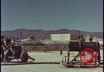 Image of atom bomb hitting oil barrels Nevada United States USA, 1955, second 13 stock footage video 65675078369