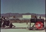 Image of atom bomb hitting oil barrels Nevada United States USA, 1955, second 15 stock footage video 65675078369