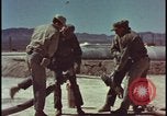 Image of atom bomb hitting oil barrels Nevada United States USA, 1955, second 18 stock footage video 65675078369