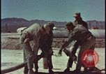 Image of atom bomb hitting oil barrels Nevada United States USA, 1955, second 19 stock footage video 65675078369