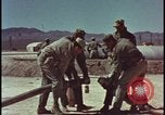 Image of atom bomb hitting oil barrels Nevada United States USA, 1955, second 20 stock footage video 65675078369