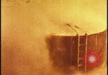 Image of atom bomb hitting oil barrels Nevada United States USA, 1955, second 32 stock footage video 65675078369
