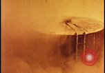 Image of atom bomb hitting oil barrels Nevada United States USA, 1955, second 33 stock footage video 65675078369