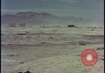 Image of atom bomb hitting oil barrels Nevada United States USA, 1955, second 48 stock footage video 65675078369