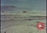 Image of atom bomb hitting oil barrels Nevada United States USA, 1955, second 50 stock footage video 65675078369