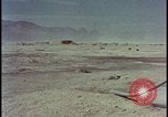 Image of atom bomb hitting oil barrels Nevada United States USA, 1955, second 51 stock footage video 65675078369