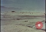 Image of atom bomb hitting oil barrels Nevada United States USA, 1955, second 52 stock footage video 65675078369