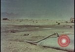 Image of atom bomb hitting oil barrels Nevada United States USA, 1955, second 54 stock footage video 65675078369